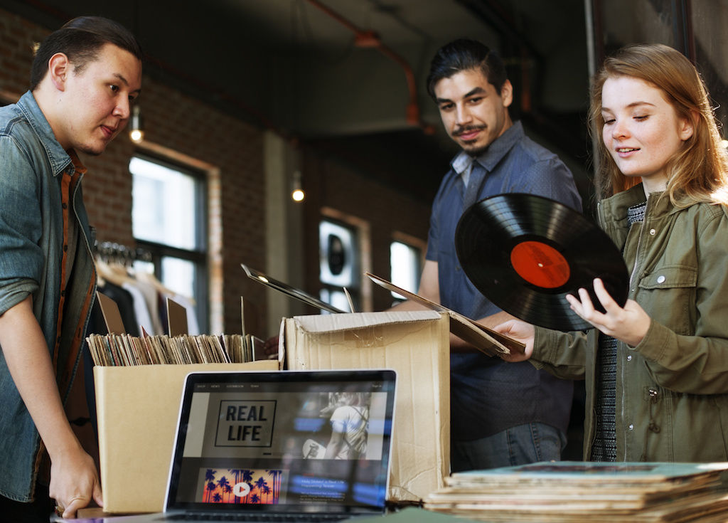 Woman holding a record at a store